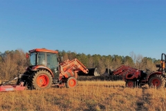 Bushhog and finishing mower cutting broom straw.