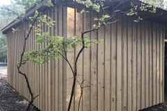 Custom cut pine board and batten siding on a Granville County barn.