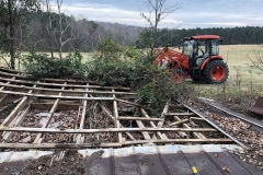 Removing tin roof by hand in a Wake Forest barn demo and removal.
