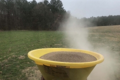 Broadcast spreading custom blended fertilizer.
